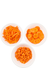 Different style of chopped carrots in white bowls