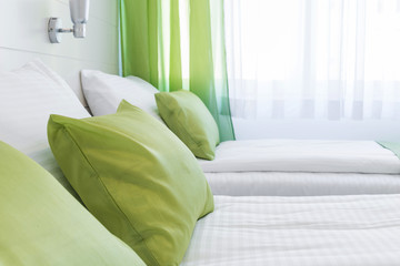 Cushions green pillows on bed