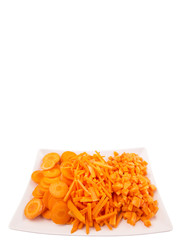 Different style of chopped carrots in white plate 