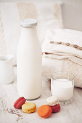 Still life interior details, glass of milk, chocolate and a book