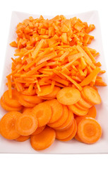 Different style of chopped carrots in a plate 