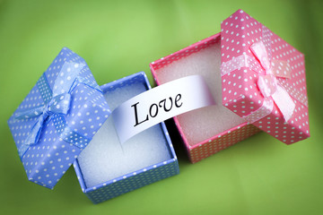LOVE message on blue and pink present boxes