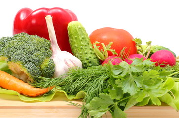 Fresh ripe raw vegetables on wooden cutting board