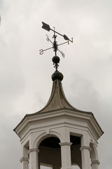 Fototapeta na wymiar Wind vane on top of tower