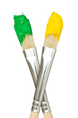 Paint brushes with yellow and green paints