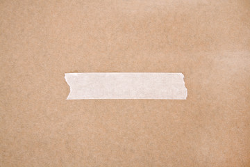 Adhesive tape on brown paper