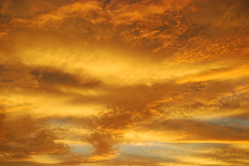 Naklejka na ściany i meble Evening sky sunset, yellow clouds