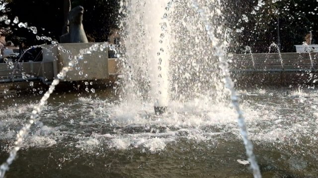 City park fountain working. Water pouring down