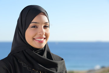 Beautiful arab saudi woman face posing on the beach