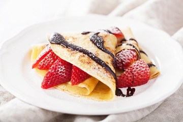 pancakes with strawberry and chocolate sauce