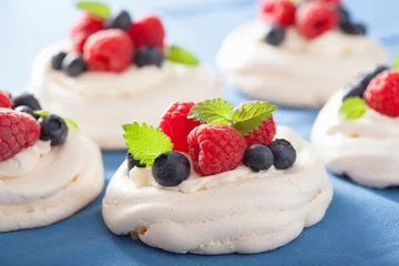 Fotobehang pavlova meringue cake with cream and berry © Olga Miltsova