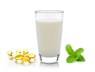 glass of milk mint and fish oil  isolated on white background
