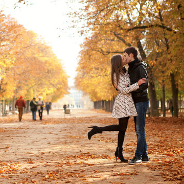 Young beautiful couple in the Luxembourg garden at fall. Paris,