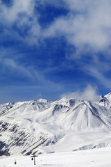 Fototapeta na wymiar Winter snowy mountains and ski slope