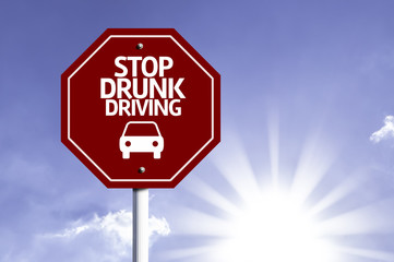 Stop Drunk Driving red sign with sun background