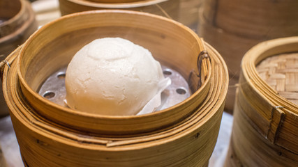 Hot steamed bun in bamboo steamer