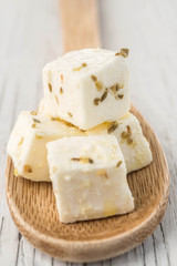 Diced feta cheese wooden spoon