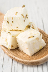 Diced feta cheese wooden spoon