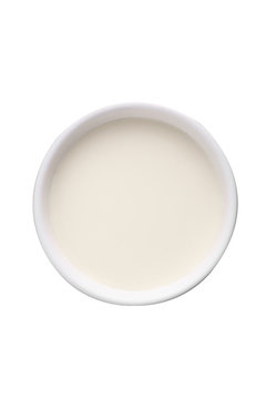 milk in ceramic cup on white background