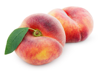 Two chinese flat donut peaches with leaf isolated on white