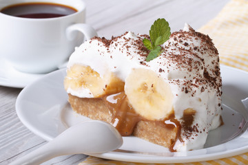 Piece of banana cake and coffee close-up horizontal