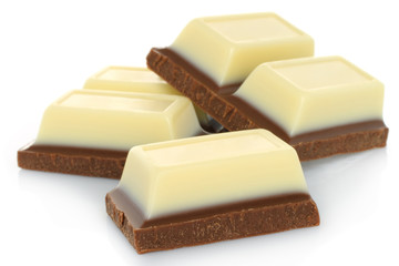 Broken black and white chocolate bar isolated