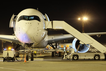 Passenger planes at the airport in the evening