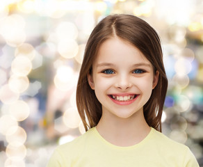 smiling little girl over white background