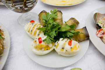 Stuffed eggs with eggplant rolls