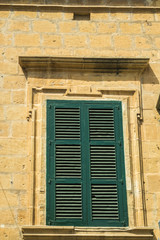 Fototapeta na wymiar Rustic windows on european old homes