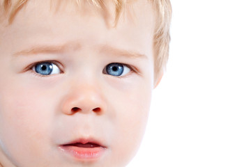 Toddler blond and blue eyes boy child with various facial expres
