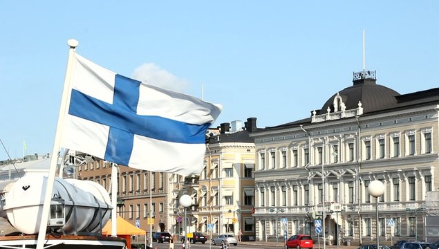 Flag of Finland Waving on city background