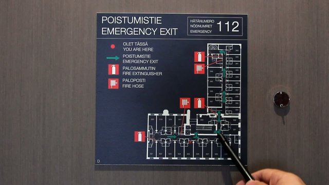 Man searching Fire escape routes on map
