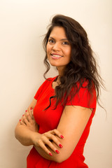 young latina woman posing with crossed arms.