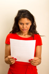 Fototapeta na wymiar concerned woman reads document.