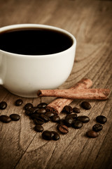 Black coffee with cinnamon sticks.