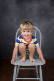 Child sitting on chair in School, Education
