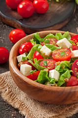 Tomato salad with lettuce, cheese and mustard and garlic dressin