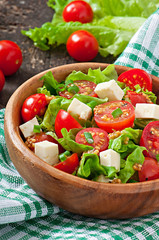 Tomato salad with lettuce, cheese and mustard and garlic dressin