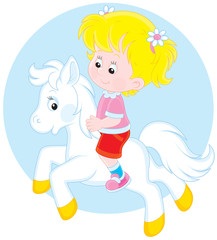Girl riding a white pony