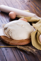 Dough on wooden board