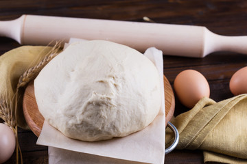 Dough on wooden board