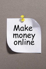Paper sheet with inscription "Make money on-line"
