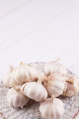 Garlic on wooden background.