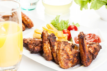 Chicken wings with fries french and spicy sauce