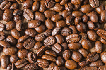 Coffee beans on wood background