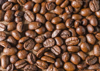 Coffee beans on wood background