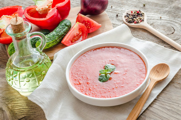 Portion of gazpacho with ingredients