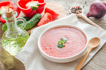 Portion of gazpacho with ingredients