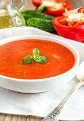 Portion of gazpacho with ingredients